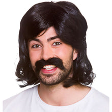A man wearing a black 1960s-style mullet wig with a matching black handlebar mustache and beard, smiling against a white background.