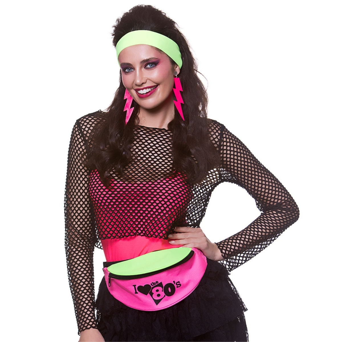 A woman modeling a 1980s retro costume outfit featuring a black fishnet long-sleeve top, a hot pink and lime green fanny pack, a lime green headband, and pink lightning-ear earrings, set against a plain white background.