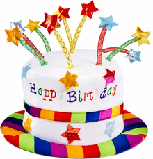 A white novelty birthday hat with a wide rainbow-striped brim, decorated with colorful star toppers and the words 'Happy Birthday' on the front, shown on a plain white background.