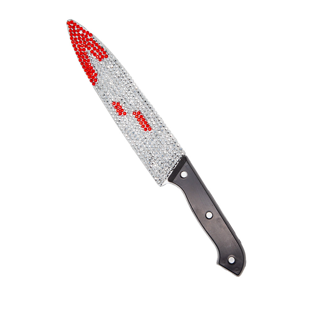 Decorative knife with a gemstone handle on a white background