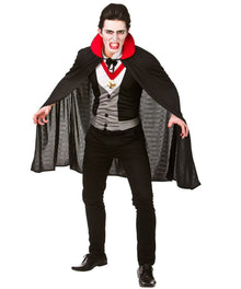 A man modeling a vampire costume against a plain white background. The costume includes a black cape with a bright red inner collar, a gray and black striped waistcoat, a white shirt, a black bow tie, and black pants.