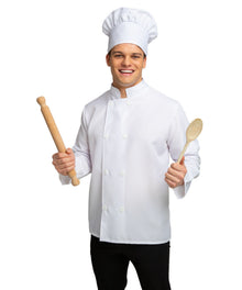 A man wearing a white chef costume jacket and matching tall chef hat, holding a wooden rolling pin in one hand and a wooden spoon in the other, against a plain white background.