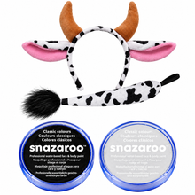 A cow-themed costume accessory set featuring a headband with pink and brown ears, black and white cow-print horns, a matching tail, and two blue-lidded jars of Snazaroo face and body paint on a white background.