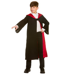 A child modeling a wizard costume consisting of a long black robe with a red inner lining, a white shirt, and black pants, set against a plain white background.