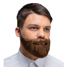 A man wearing a brown synthetic fake beard with a black ear loop, shown from the chest up against a plain white background.
