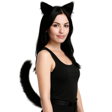 A woman wearing a black cat costume accessory set, including a pair of fluffy black cat ears on a headband and a long black faux-fur tail, against a plain white background.
