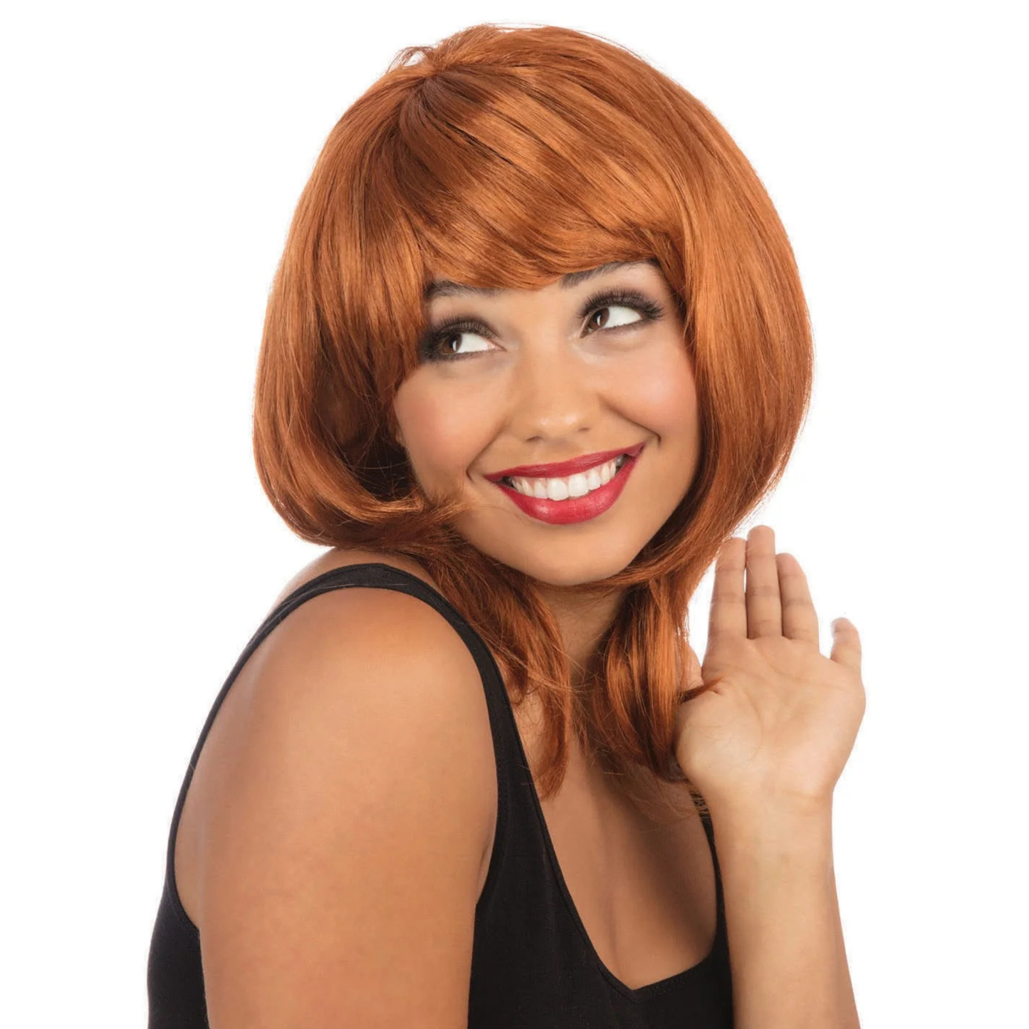 A woman wearing a short, layered strawberry-blonde wig with bangs, smiling and looking to the side against a plain white background.