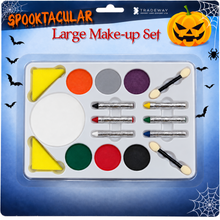 Tradeway Spooktacular Large Make-up Set in its original retail blister packaging. The set contains multiple makeup pans in orange, gray, purple, yellow, green, red, black, and white, along with dual-ended applicators and crayons, all mounted on a blue Halloween-themed backing card decorated with spiderwebs, bats, and a jack-o'-lantern.