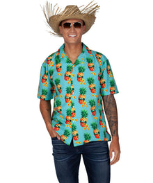 A man wearing a turquoise short-sleeve button-up shirt with a colorful pineapple and floral print, styled with a straw cowboy hat, sunglasses, and dark blue jeans against a plain white background.