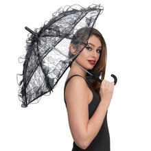 Woman holding a black lace umbrella on a white background