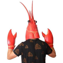 Person wearing a red lobster helmet and gloves on a white background