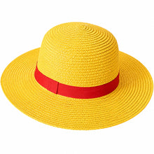 A yellow woven straw sun hat with a wide brim and a red ribbon band around the crown, shown on a plain white background.