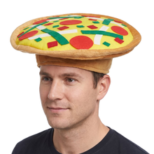 A man wearing a novelty plush hat shaped like a pizza on a tan band, photographed against a plain white background.