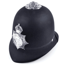 A black traditional hard plastic British police helmet with silver metallic badges, including a central police badge and a decorative finial on top, shown on a plain white background.