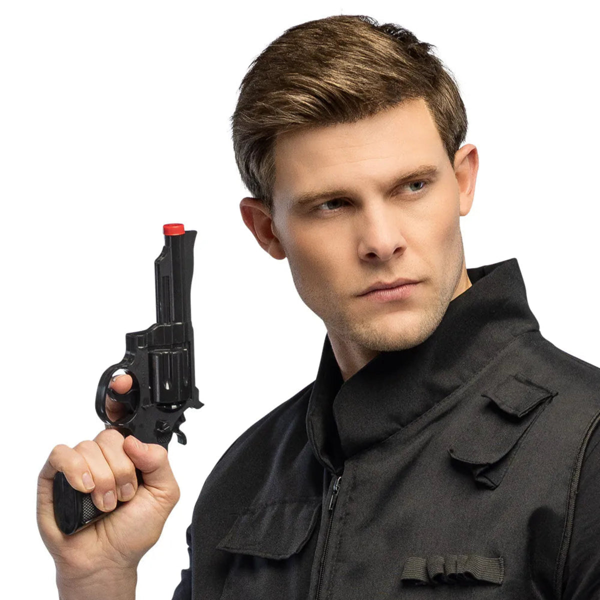 Man in tactical gear holding a toy gun against a white background