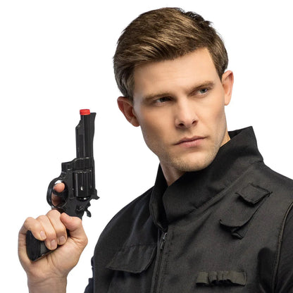Man in tactical gear holding a toy gun against a white background