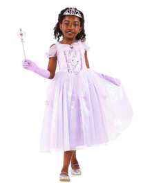 A young girl modeling a light purple princess costume dress with a matching tiara, gloves, and holding a wand against a plain white background.