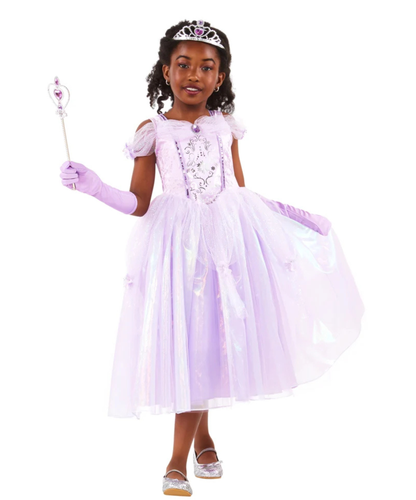 A young girl modeling a light purple princess costume dress with a matching tiara, gloves, and holding a wand against a plain white background.