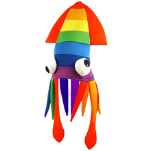 A plush rainbow squid hat with a striped cap in red, orange, yellow, green, blue, and purple, featuring long rainbow tentacles and white cartoon eyes.