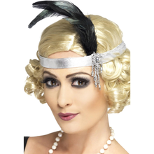 Woman wearing a blonde wig with a black feather and silver headband on a white background