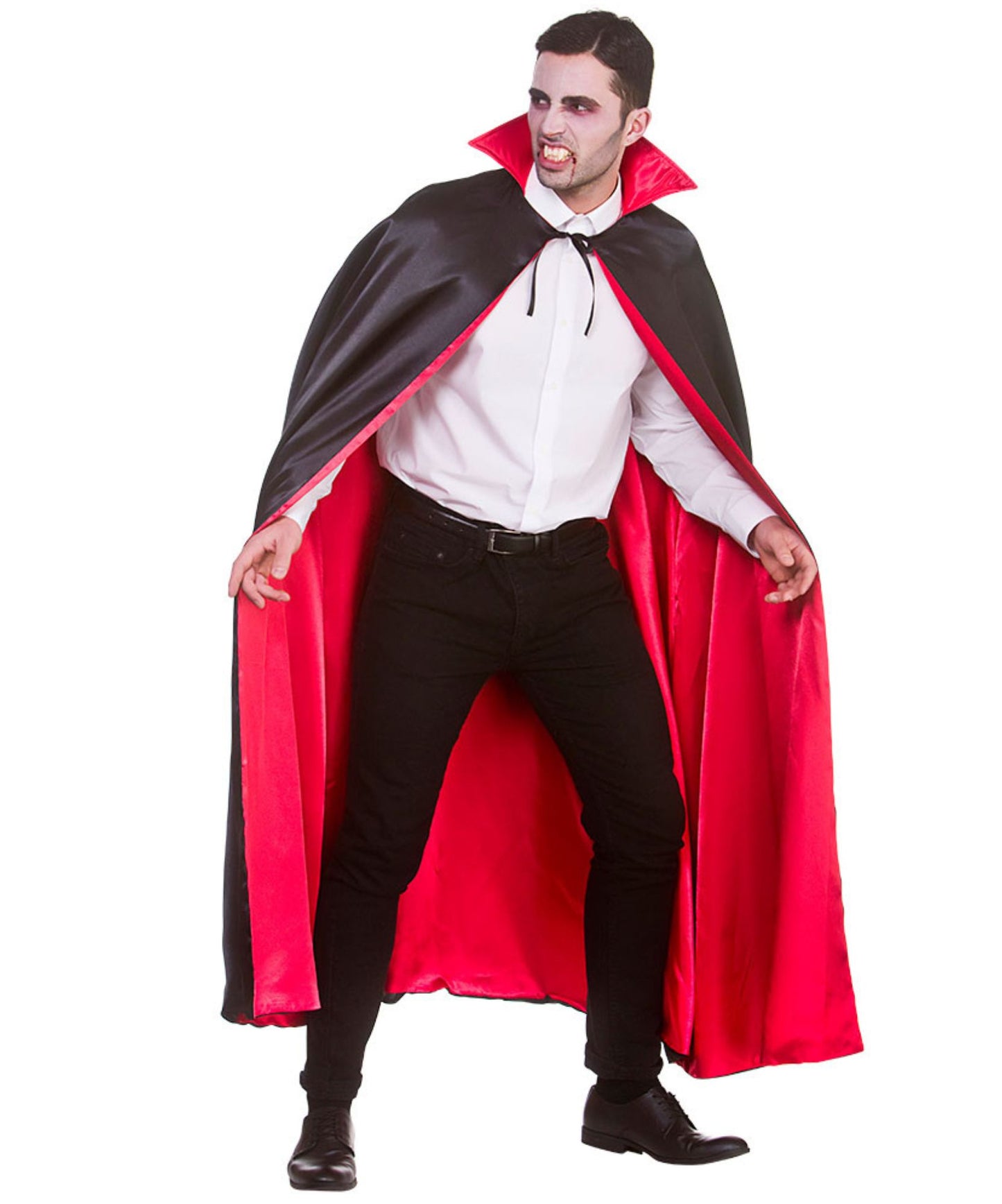 A man modeling a black and red vampire cape costume over a white dress shirt, black pants, and black shoes, against a plain white background.