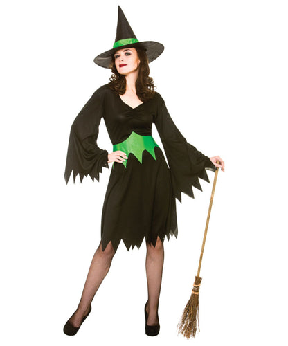 Woman in a witch costume with a broom on a white background