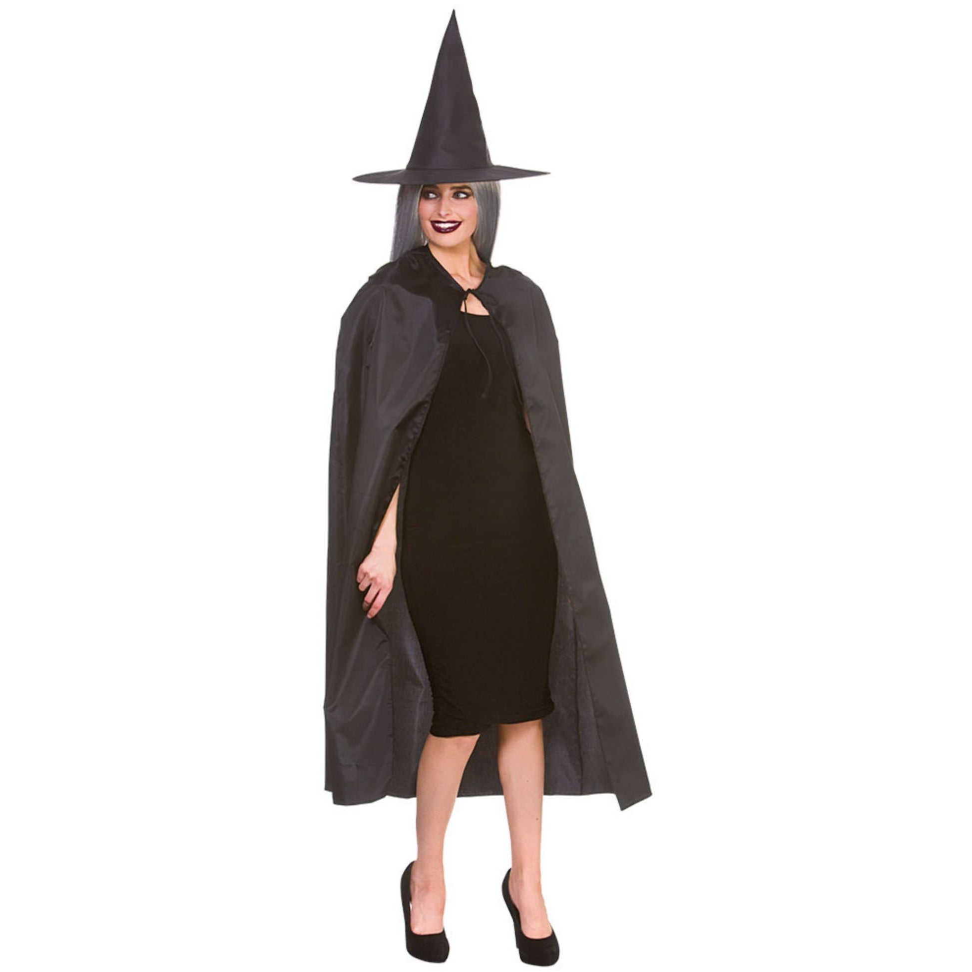 Person wearing a witch costume with a black hat and cape on a white background