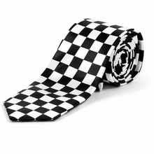 A black and white checkered necktie, partially unrolled to show its pattern, with the rest rolled up, set against a plain white background.