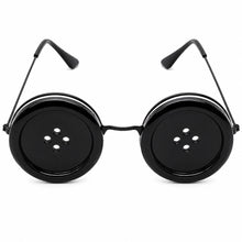 Black novelty round sunglasses with oversized button-shaped lenses and thin metal temples, shown on a plain white background.