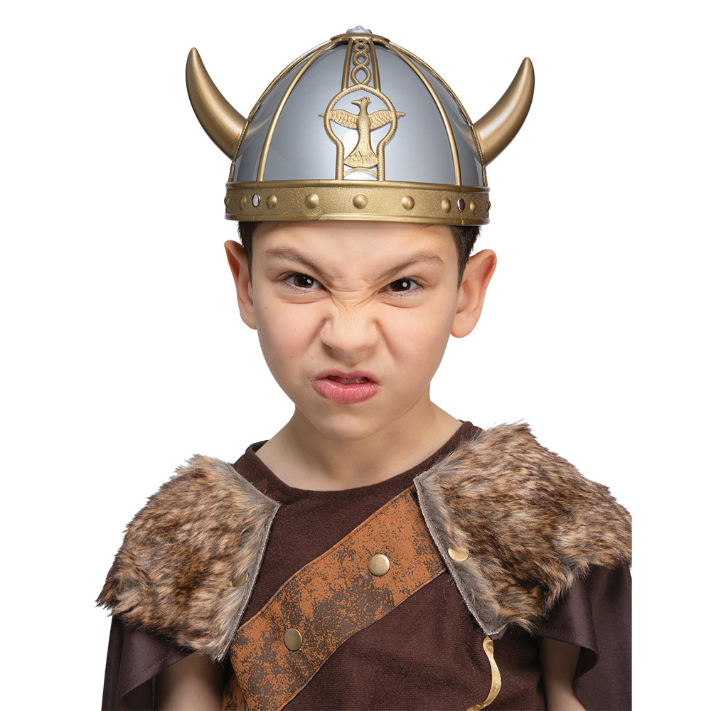 Child wearing a Viking costume with a helmet and fur collar on a white background