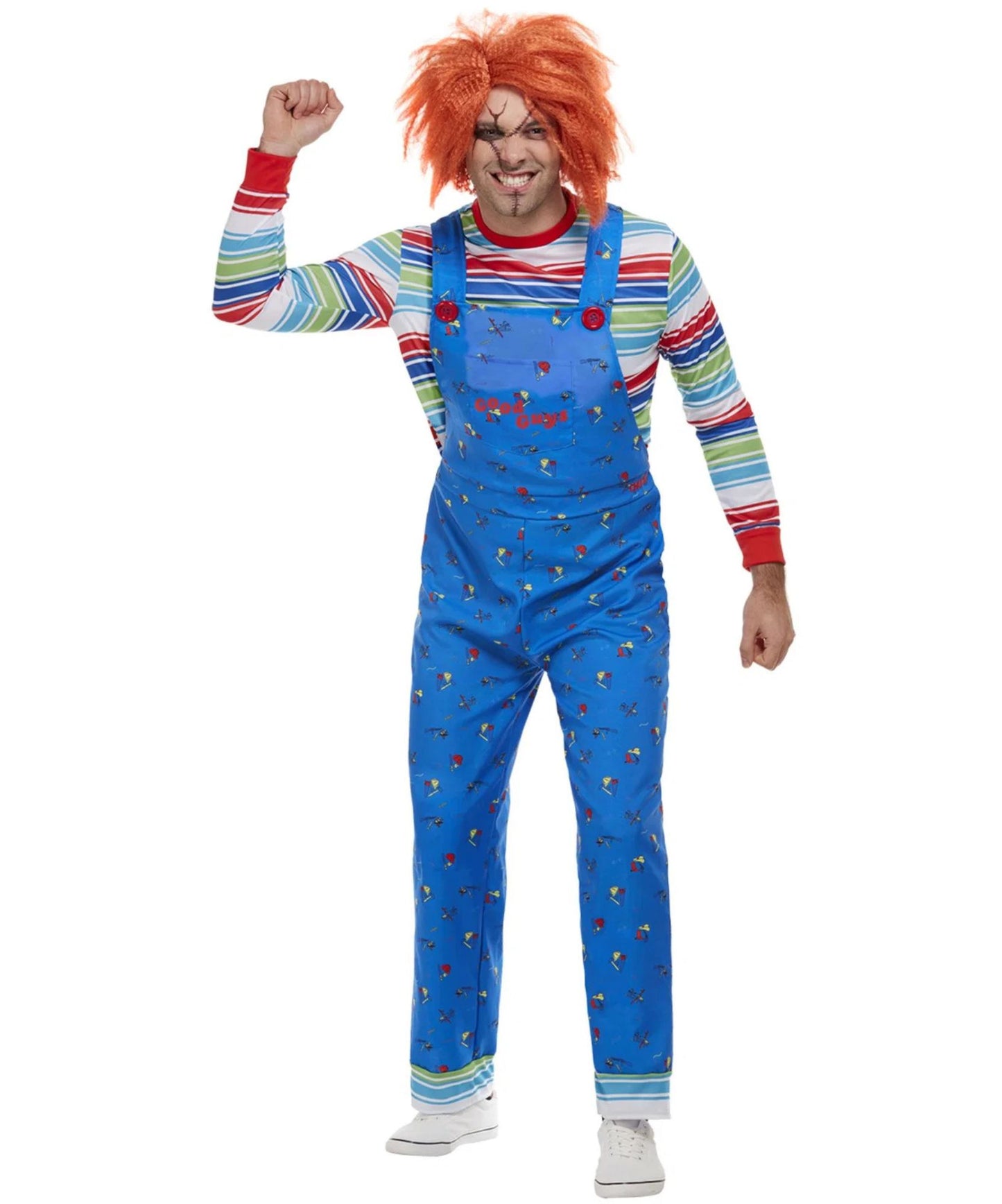 A man modeling a Chucky costume consisting of blue overalls with a red and blue striped shirt underneath, a bright orange wig, and a creepy painted face, set against a plain white background.