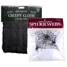 Two packages of Halloween decorations on a white background: a black spooky gauze cloth labeled 'Spine Chilling Creepy Cloth' and a stretchable white plastic sheet with printed black spider webs labeled 'Stretchable Spider Webs'.