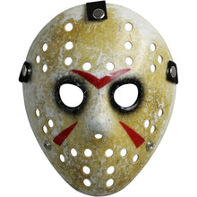 Worn Jason-style mask with perforated design and red accents on a white background