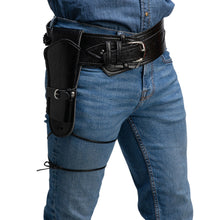 A close-up of a person wearing blue jeans and a black leather belt with a side holster pouch, shown from the waist down on a white background.