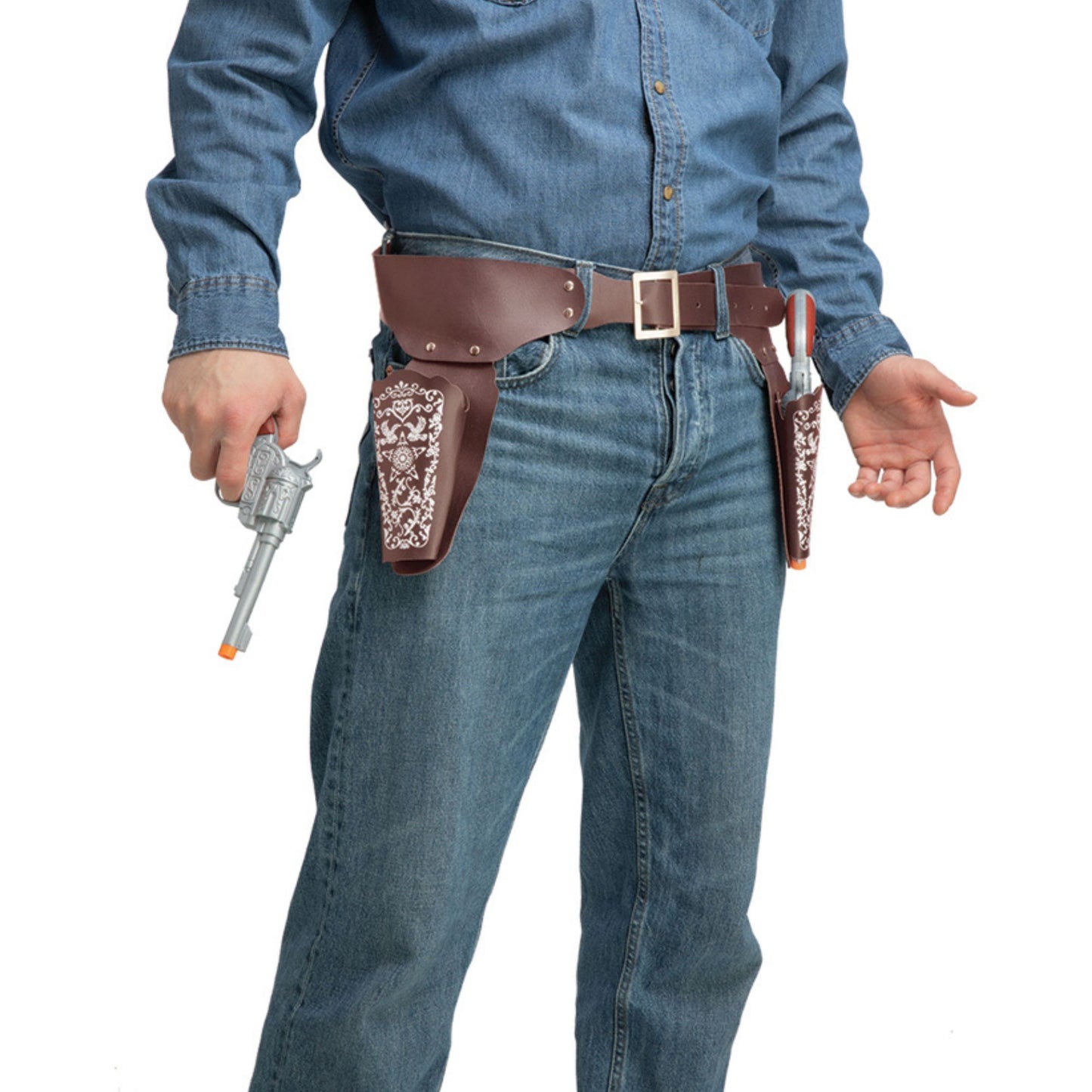 A person wearing a brown leather belt holster set with patterned brown and white side panels, paired with a blue denim shirt and jeans, holding a toy revolver against a white background.
