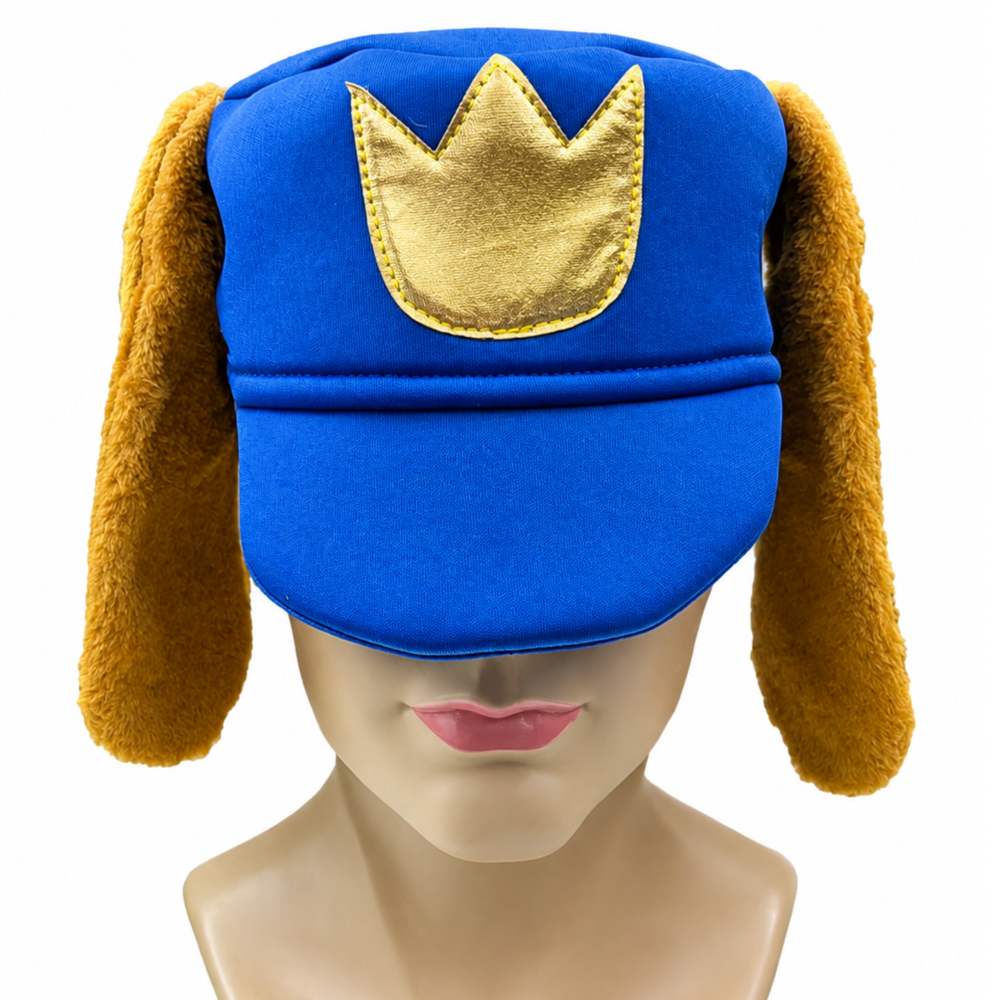 A royal blue hat with long brown floppy ear flaps and a gold crown applique on the front, displayed on a mannequin head against a white background.