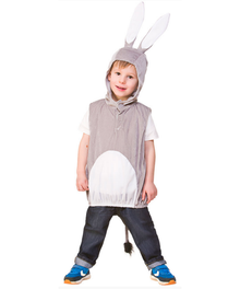 A child wearing a gray and white bunny costume with long white bunny ears on the hood, a gray sleeveless vest, a white belly patch, dark jeans, and blue sneakers, photographed against a plain white background.