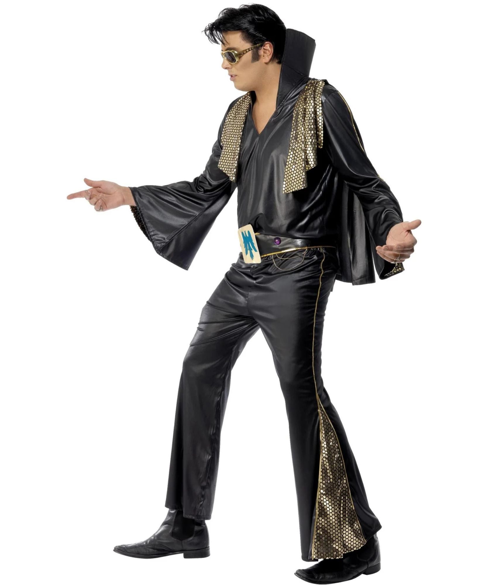 A man modeling a black Elvis-style costume with shiny black fabric, gold mesh trim along the shoulders and legs, a gold belt, and gold sunglasses, posed against a plain white background.