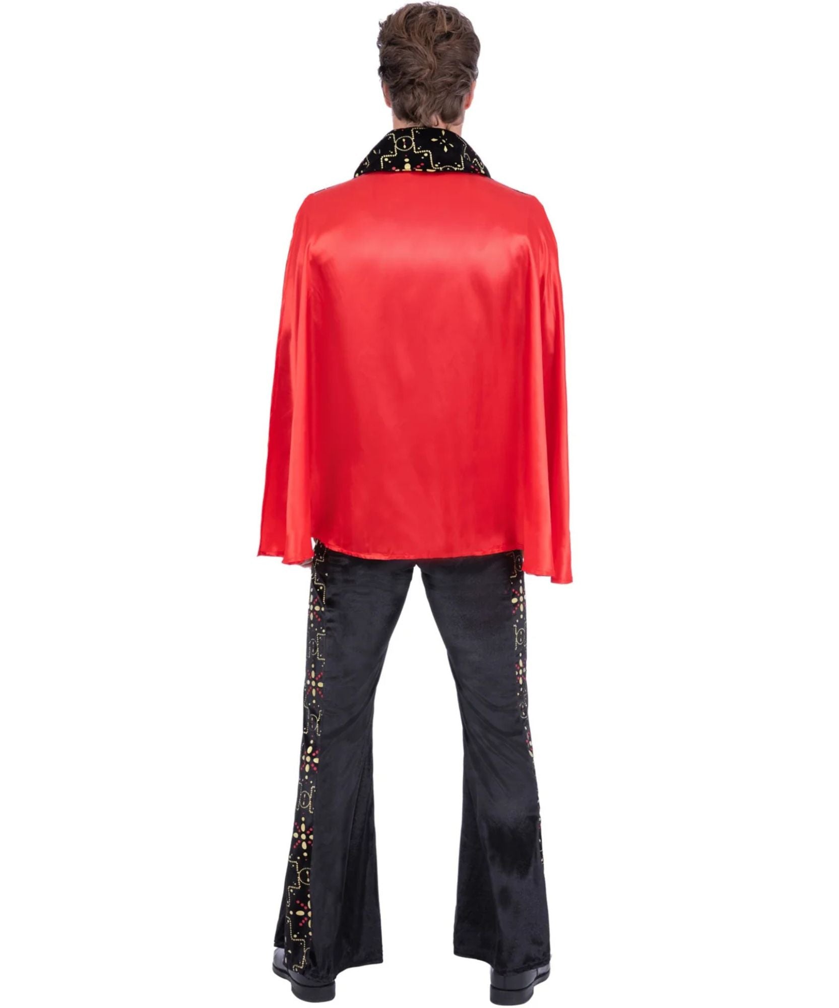 A model shown from the back wearing a red satin cape-style jacket with a black sequined collar and black flared pants with gold sequin trim, against a plain white background.