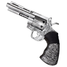Decorative foam revolver with intricate designs on a white background