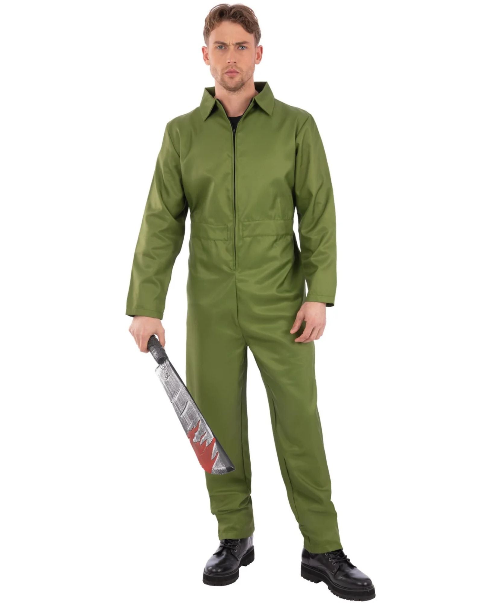 A man modeling an olive green full-body coverall costume against a plain white background, holding a large machete prop.