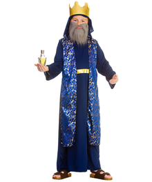 A man wearing a blue and gold king or prince costume with a matching gold crown, fake gray beard, and sandals, holding a small bottle against a plain white background.