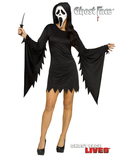 A woman modeling a Ghost Face Halloween costume on a plain white background, holding a knife prop. The costume includes a black hooded dress with wide draped sleeves and jagged hem, a white Ghost Face mask, and the Ghost Face Lives logo appears at the bottom right.