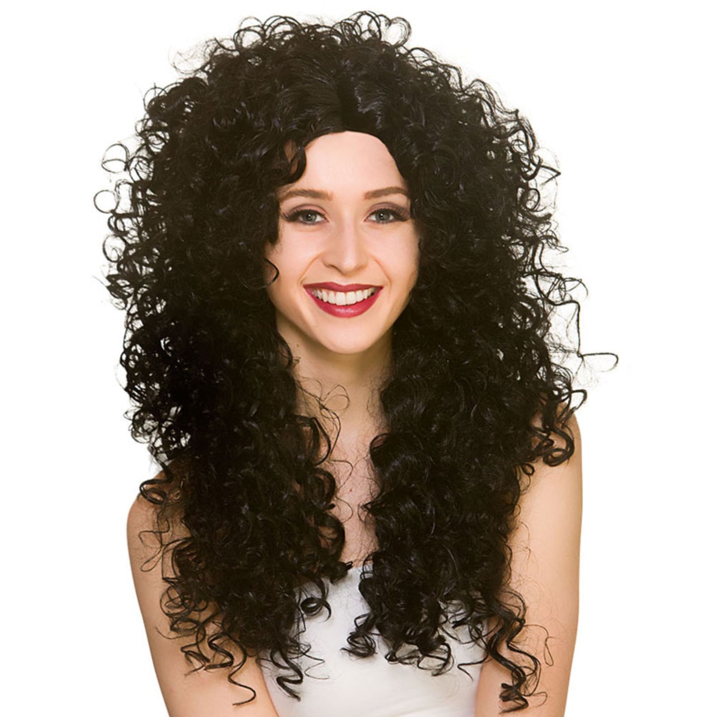 A smiling woman with a voluminous, curly black wig against a plain white background.
