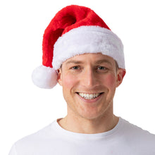 A smiling man wearing a red and white Santa hat, photographed against a plain white background.