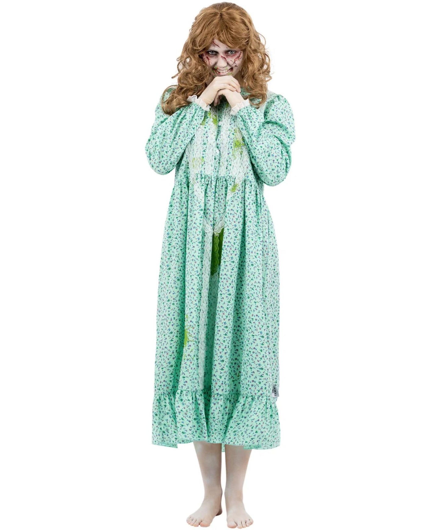 A woman modeling a long, light green nightgown with a white floral print, styled with a curly brown wig and a creepy clown face mask against a plain white background.