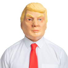 A realistic novelty mask of Donald Trump with blond hair, blue eyes, and a neutral expression, shown wearing a white dress shirt and red tie against a plain white background.