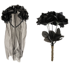 Black fabric rose headband with a sheer black tulle veil on the left, and a matching black fabric rose bouquet with dark leaves and a brown-wrapped stem on the right, shown against a plain white background.