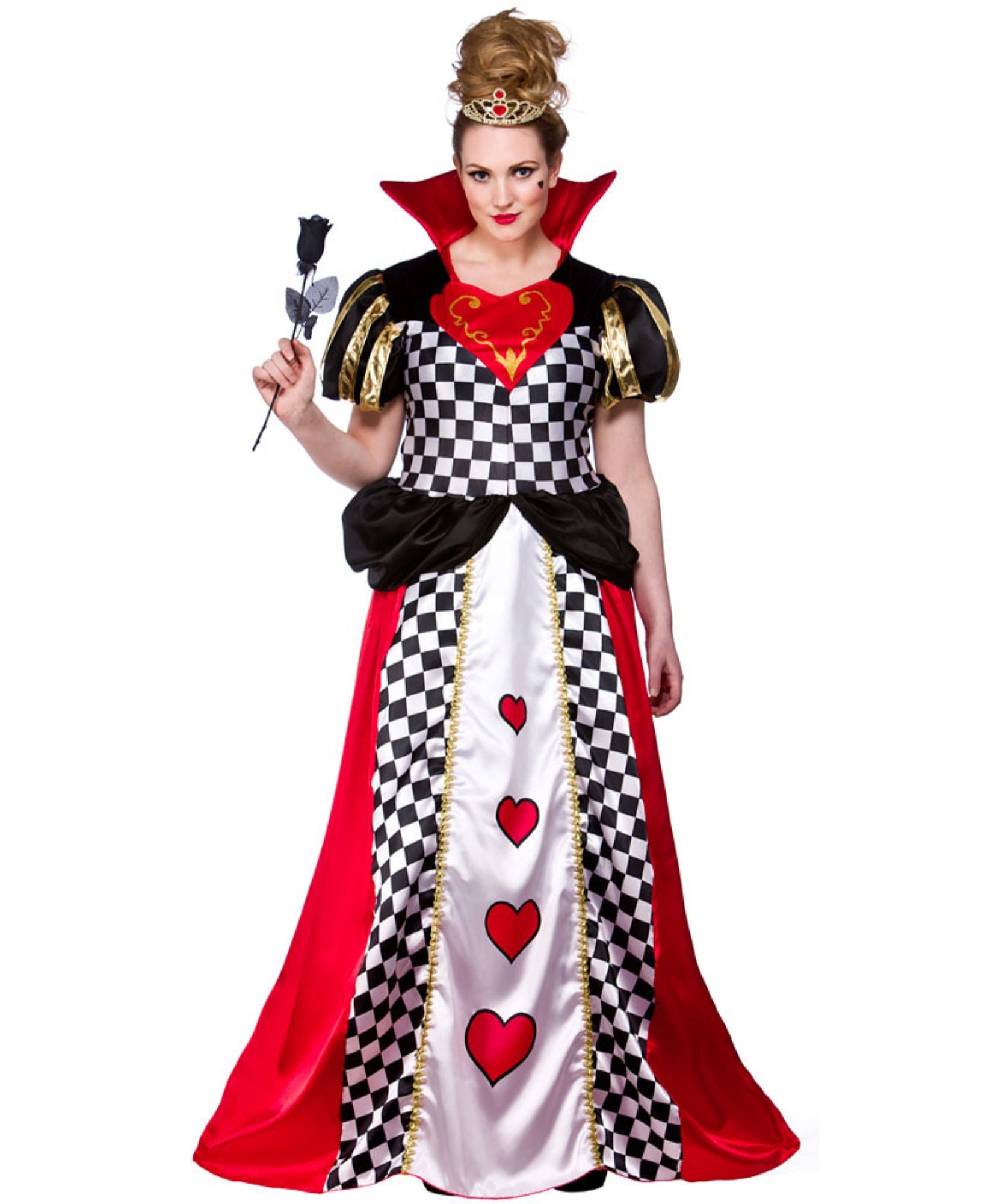 A woman modeling a Queen of Hearts costume dress against a plain white background. The costume features a black and white checkered bodice, a white skirt with red hearts, a red cape, and gold trim.