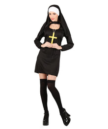 A woman modeling a black nun costume with a white veil, black thigh-high stockings, black platform heels, and a gold cross pendant against a plain white background.